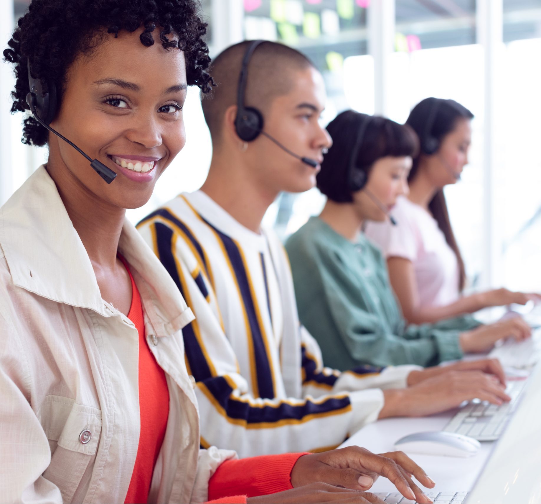 Portait of African-american customer service executives working on computer at desk in office